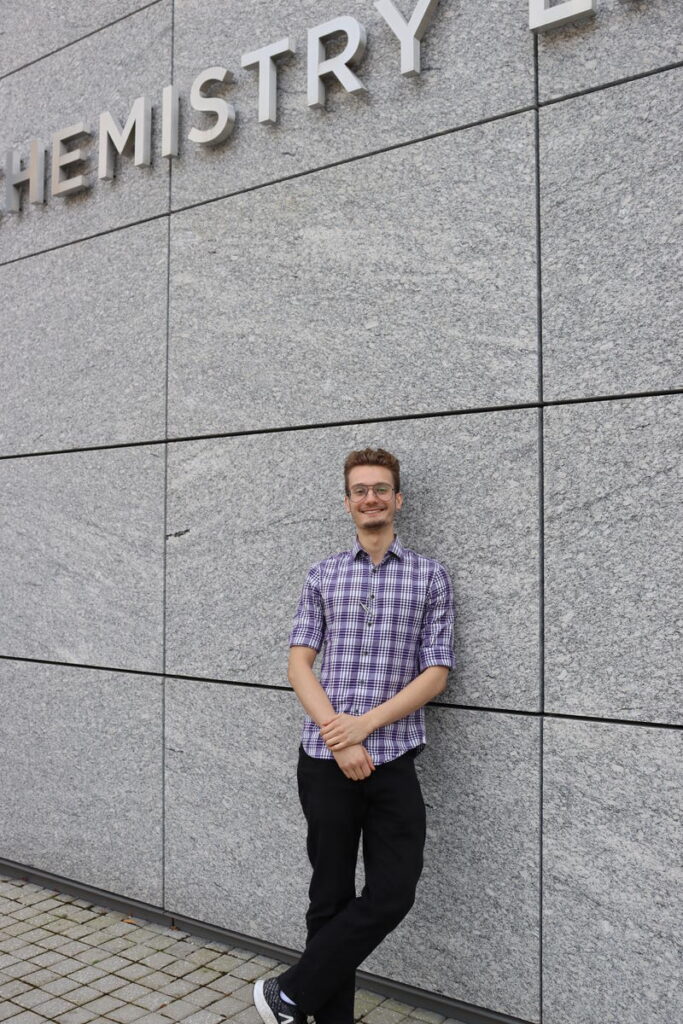 Full color image of Andre standing outside Frick Lab