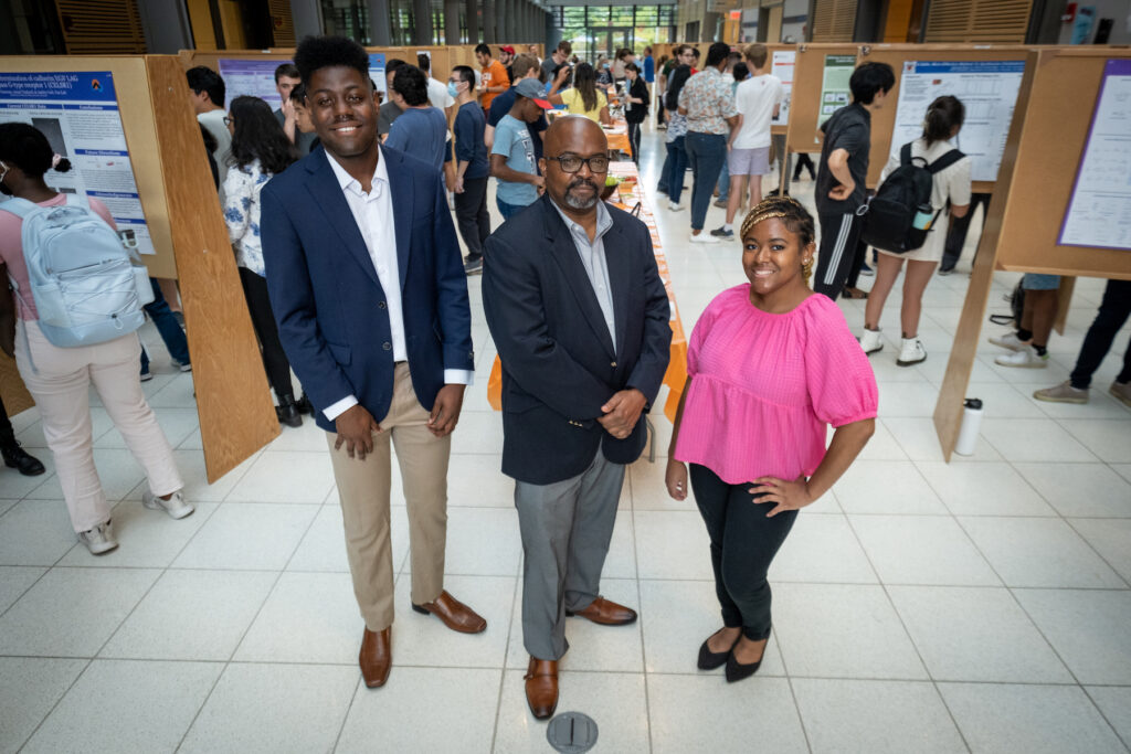 Tolulope Salami (center) with his trailing undergraduates at the Symposium: Jayden Thomas (left) and Jodeci Mitchell (right).