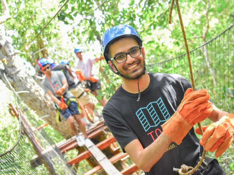 Dhruv Dhingani on a ropes course in the trees