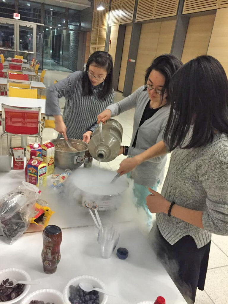 Members of PUCS making ice cream with liquid nitrogen