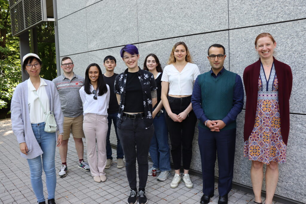 Color image of group standing outside Frick Lab