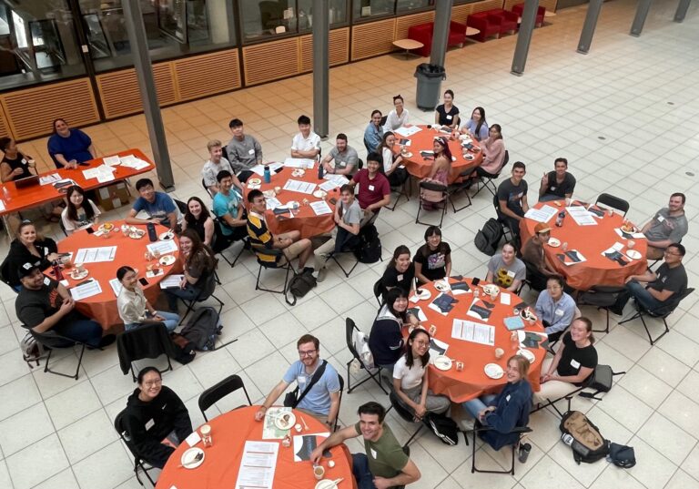 Color image of the new cohort at orientation breakfast.