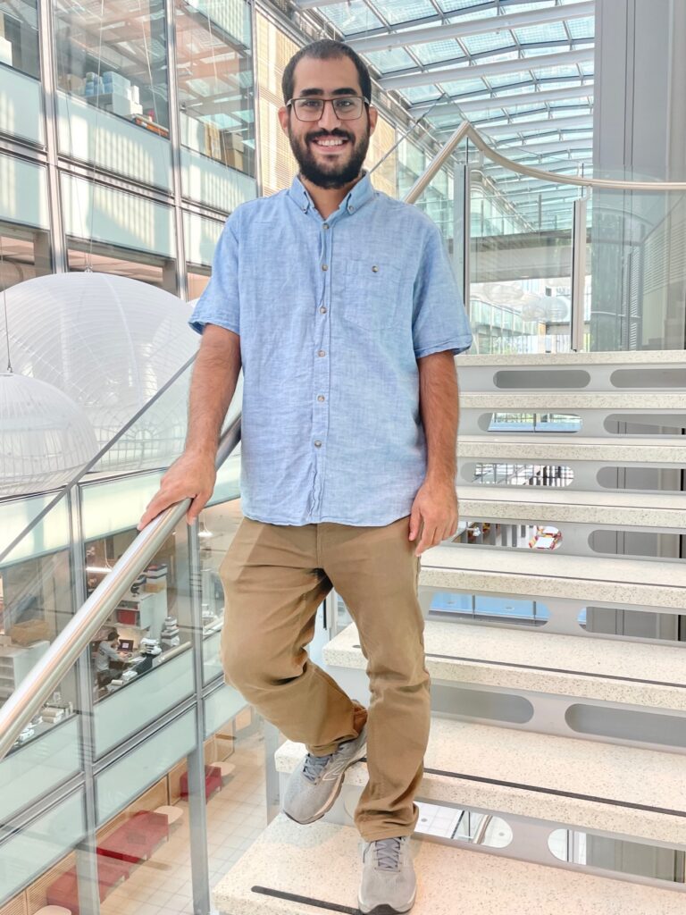 Full-color image of Qais Jaber on the staircase at Frick lab.